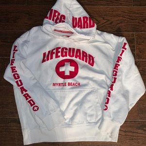 A red and white lifeguard sweatshirt